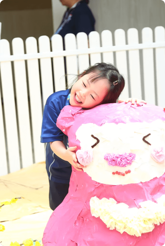 Chatsworth preschool home girl hugging a teddy bear