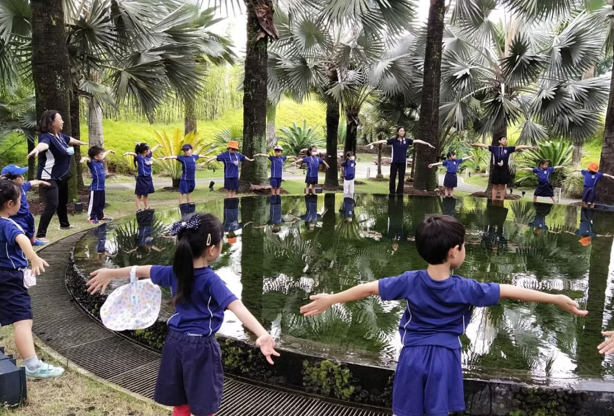 Chatsworth preschool home students standing around a pond