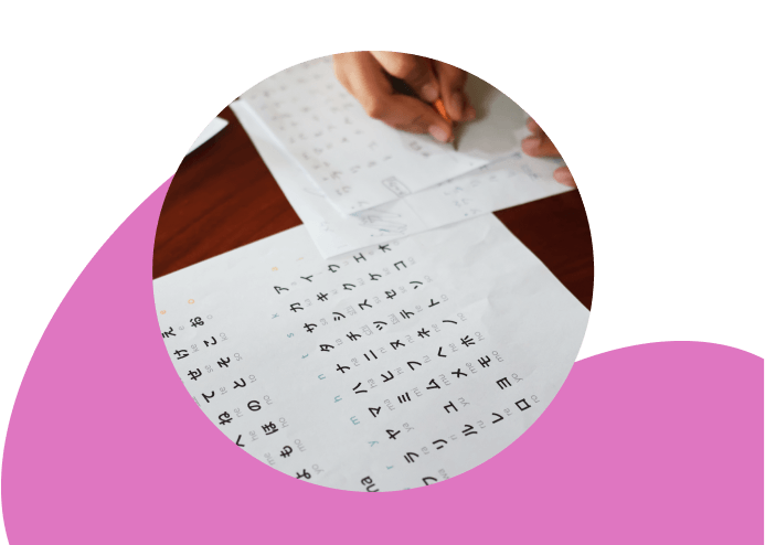 kid practicing japanese language alphabet